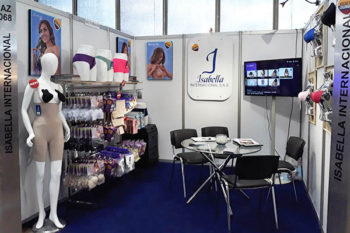 Top view of woman's black bra on the unmade bed