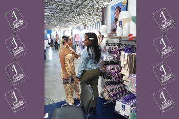 Top view of woman's black bra on the unmade bed