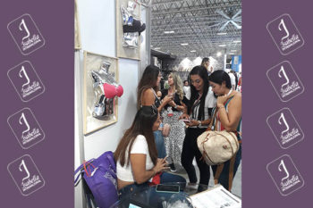 Top view of woman's black bra on the unmade bed