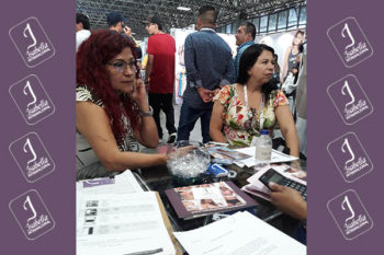 Top view of woman's black bra on the unmade bed