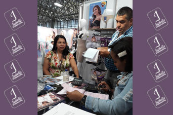 Top view of woman's black bra on the unmade bed
