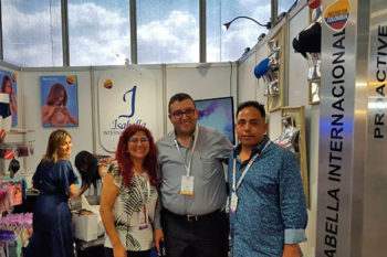 Top view of woman's black bra on the unmade bed