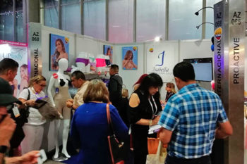 Top view of woman's black bra on the unmade bed