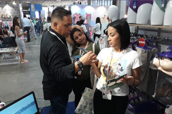 Top view of woman's black bra on the unmade bed
